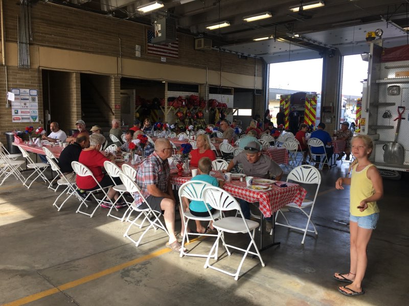 Neighbors of all ages gathered together at a community pancake breakfast